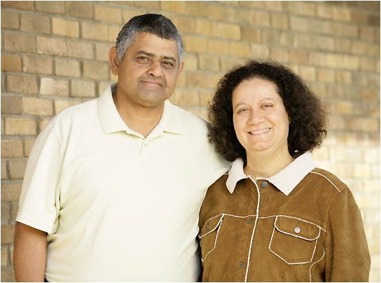 A man and woman standing next to each other.